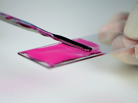 One part epoxy changes from red to clear under UV light